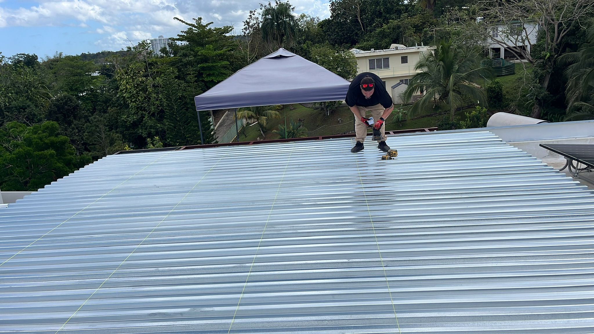 Metal roof panel installation